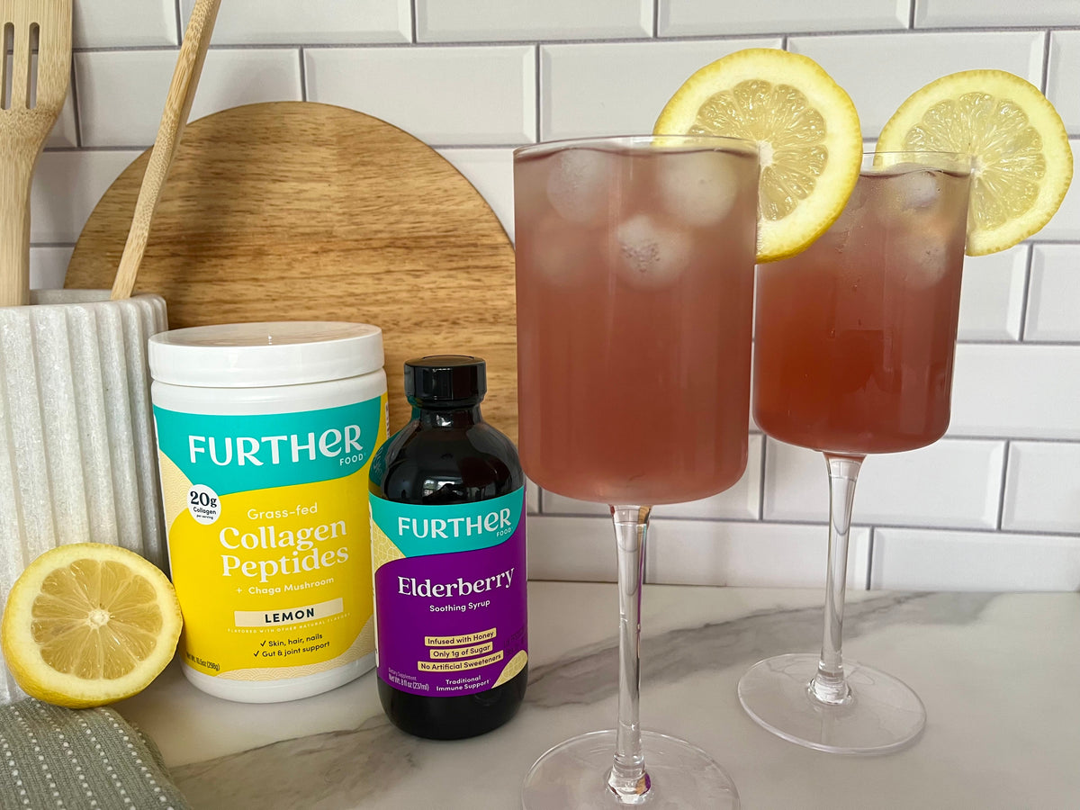 Image of lemon collagen and elderberry jar with glasses of spritz